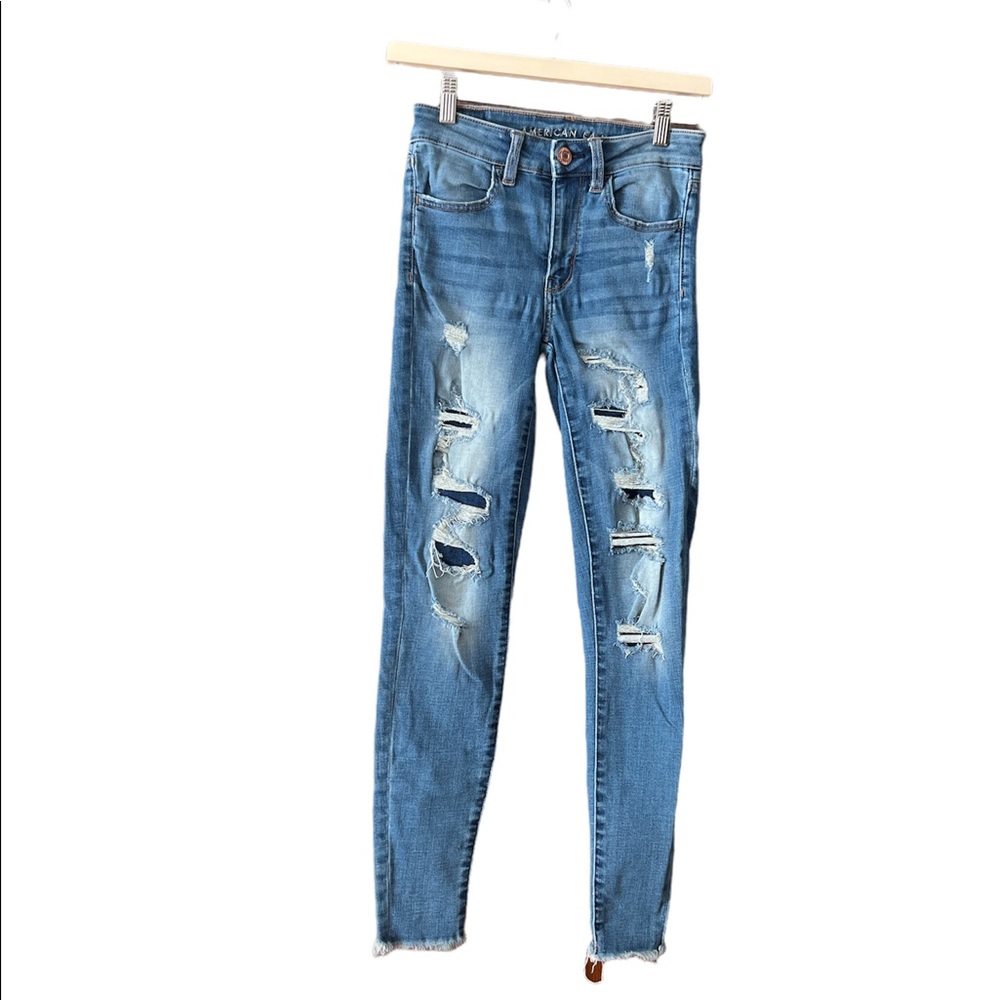 American Eagle Super Stretch Distressed Light Rough Hem Jeans/Jeggings